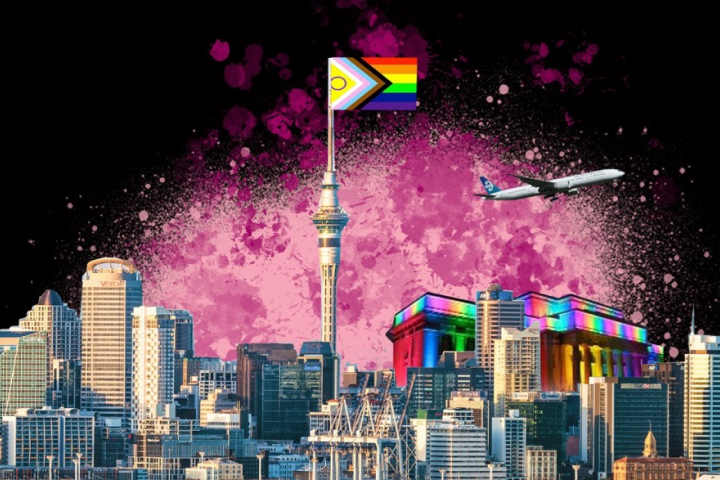 A city with a rainbow flag in the sky.