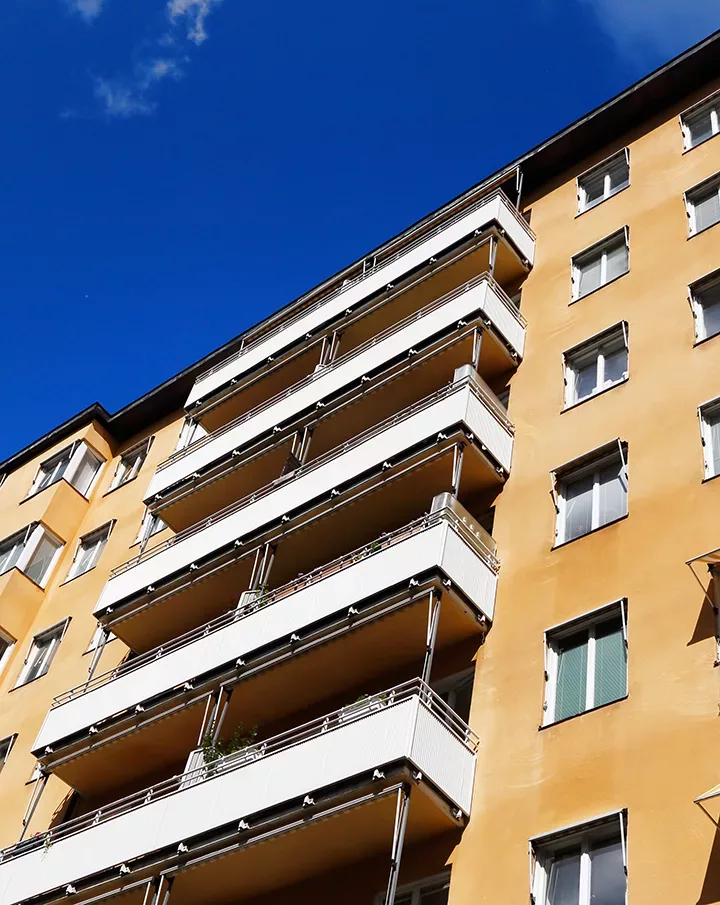 light brown painted housing building in Stockholm