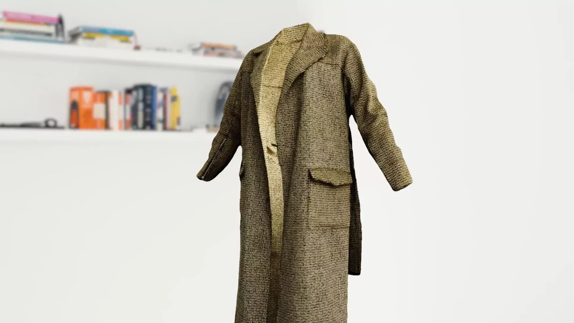 virtual long tweed coat floating in front of bookshelf