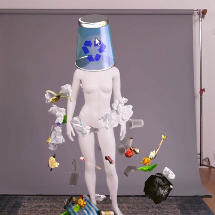 mannequin with trash can over the head and trash floating around