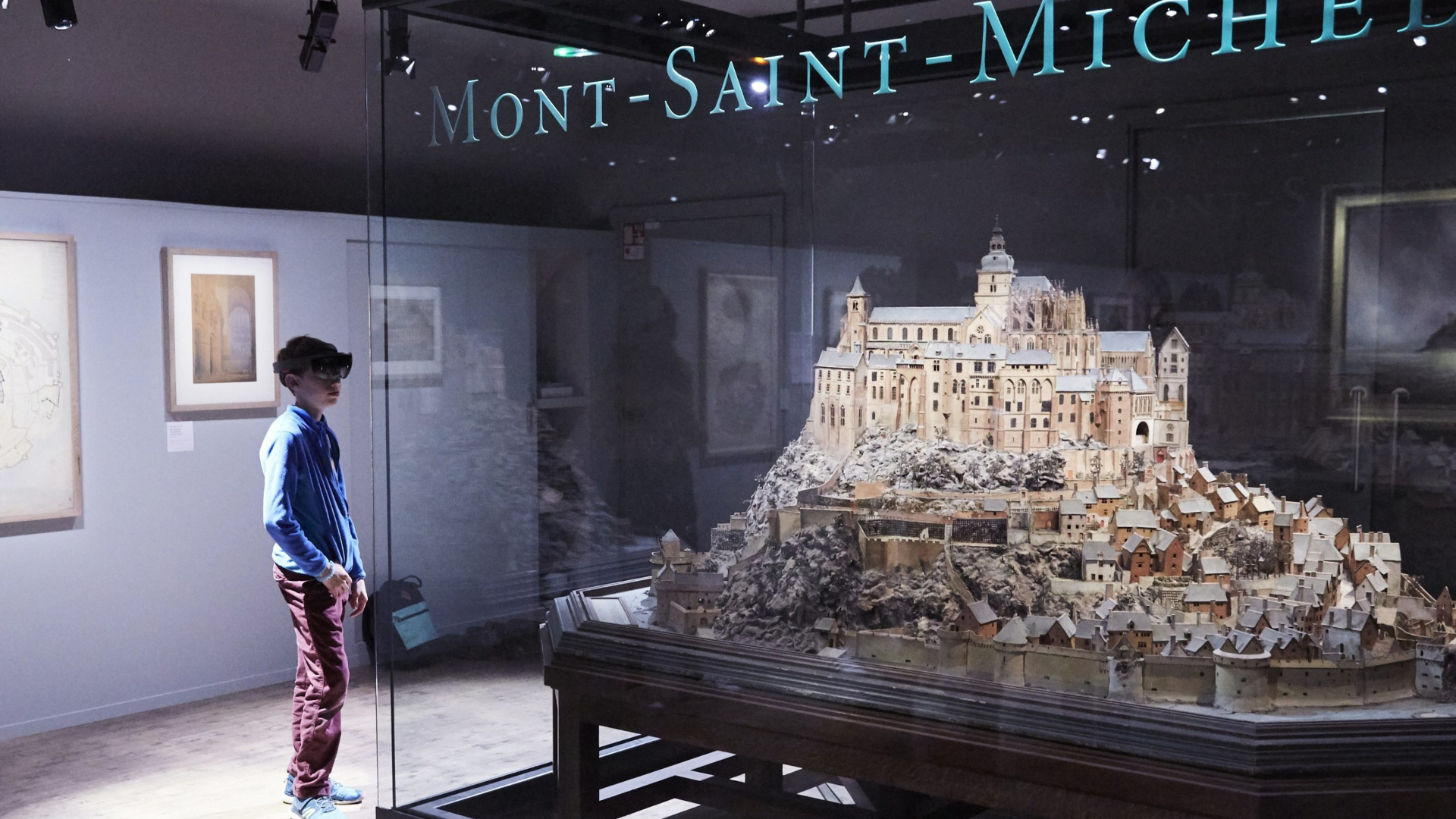 kid viewing Mont St Michel exhibit