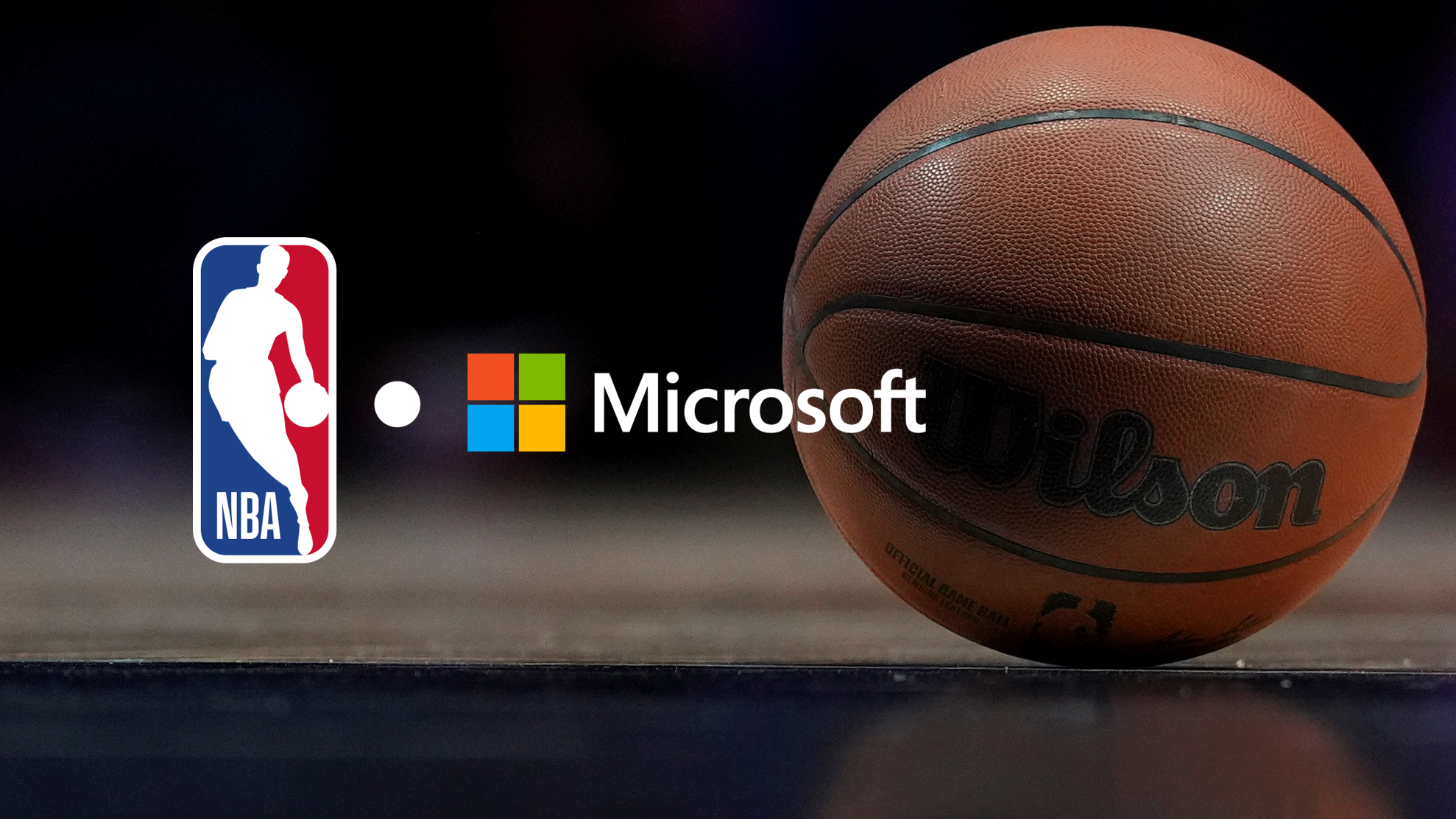 A basketball on an empty court. NBA and Microsoft partnership logo lockup.
