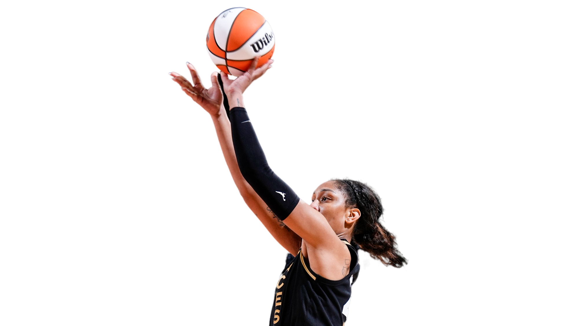 WNBA basketball player, A’ja Wilson is mid-jump with a basketball in her hands. She is portrayed in front of a white background.