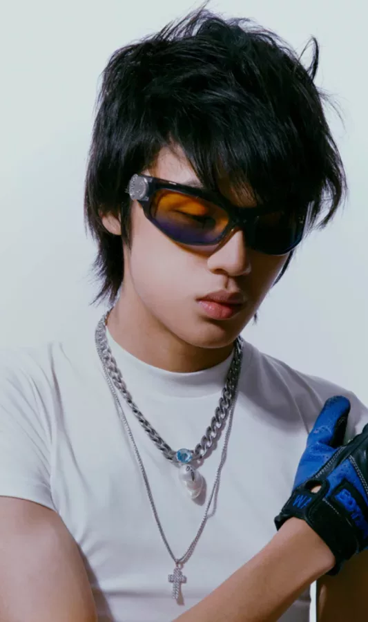 A young man wearing sunglasses and a glove.
