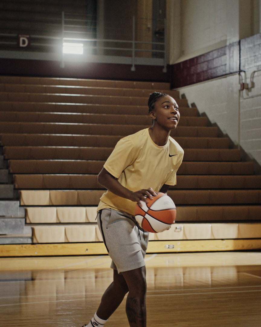 Jewell Loyd on basketball court with ball in hand.