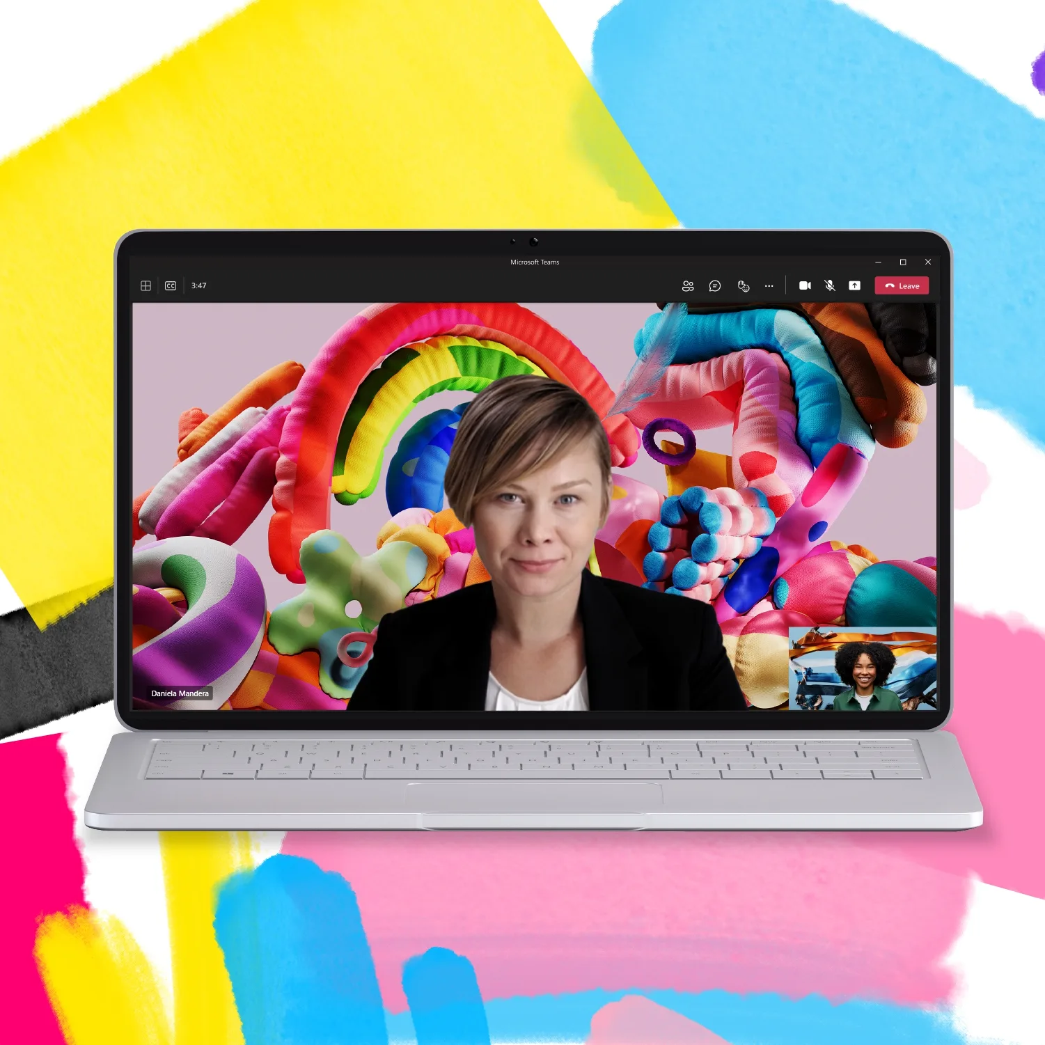 A laptop with a woman's face on a colorful background.