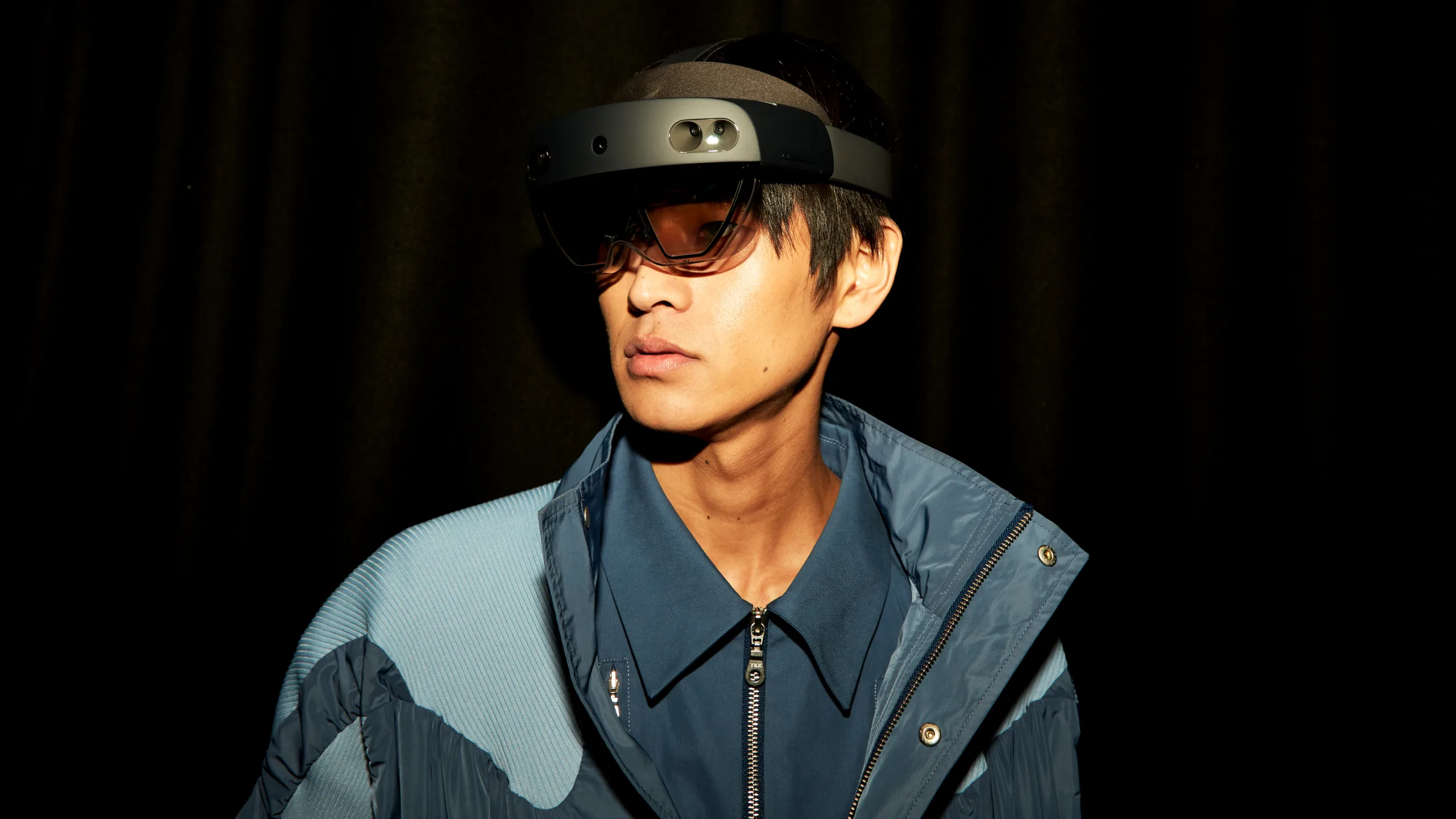 Fashion creator wearing a HoloLens, which allows users to experience mixed reality fashion shows from wherever they are
