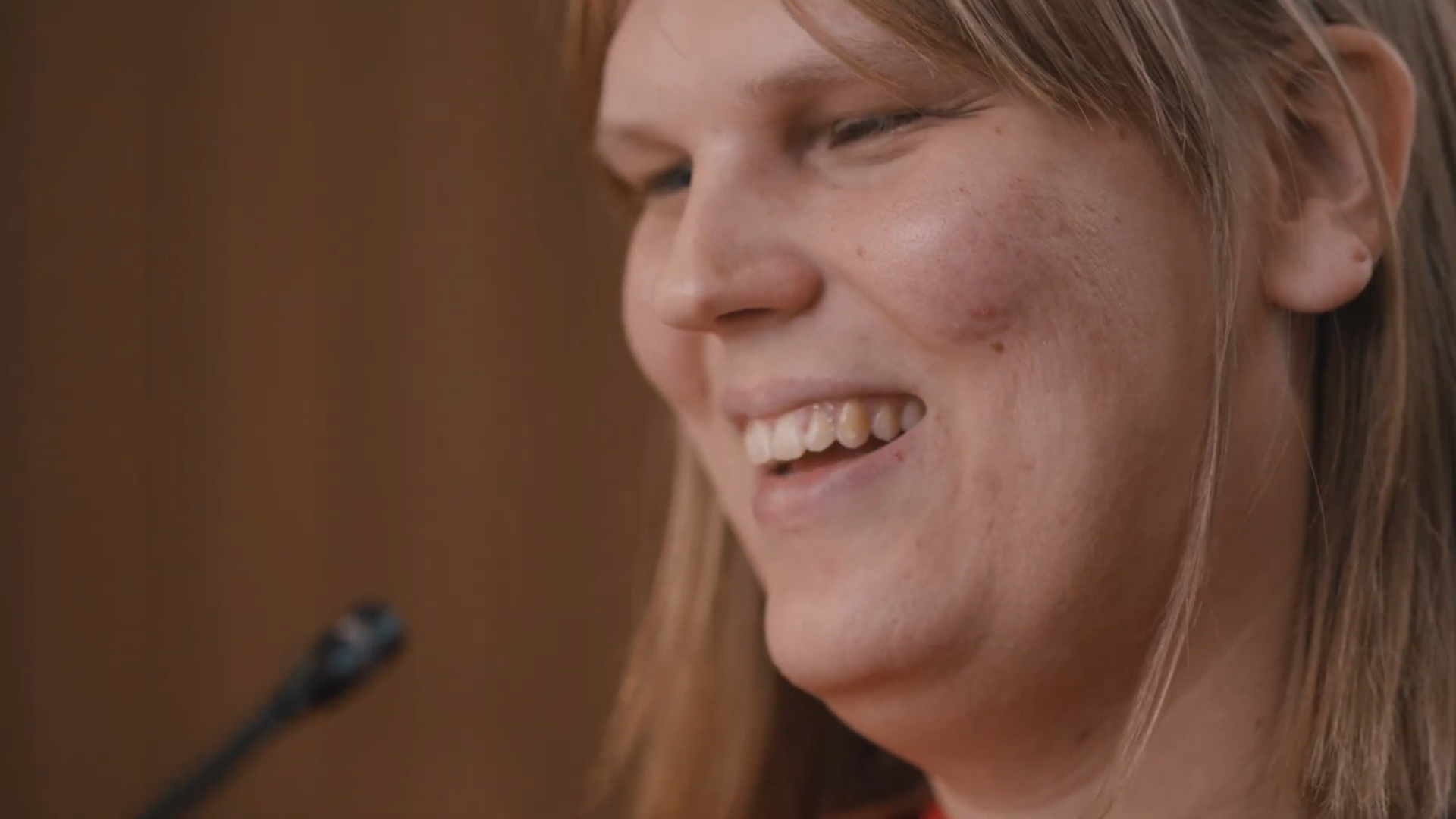 A close-up photo of a smiling woman.