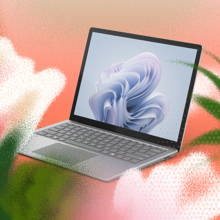 A laptop displaying an abstract wallpaper sits against a colorful, gradient background with a textured overlay.