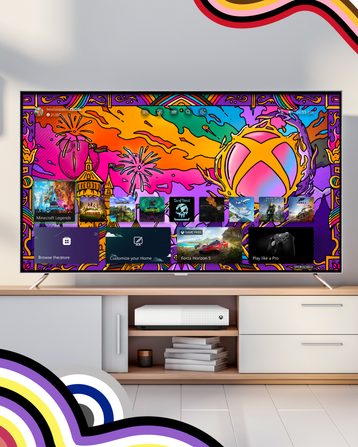 A TV displays a colorful Xbox gaming interface with multiple game icons. The TV sits on a white stand with a gaming console below it. The background has colorful patterns.
