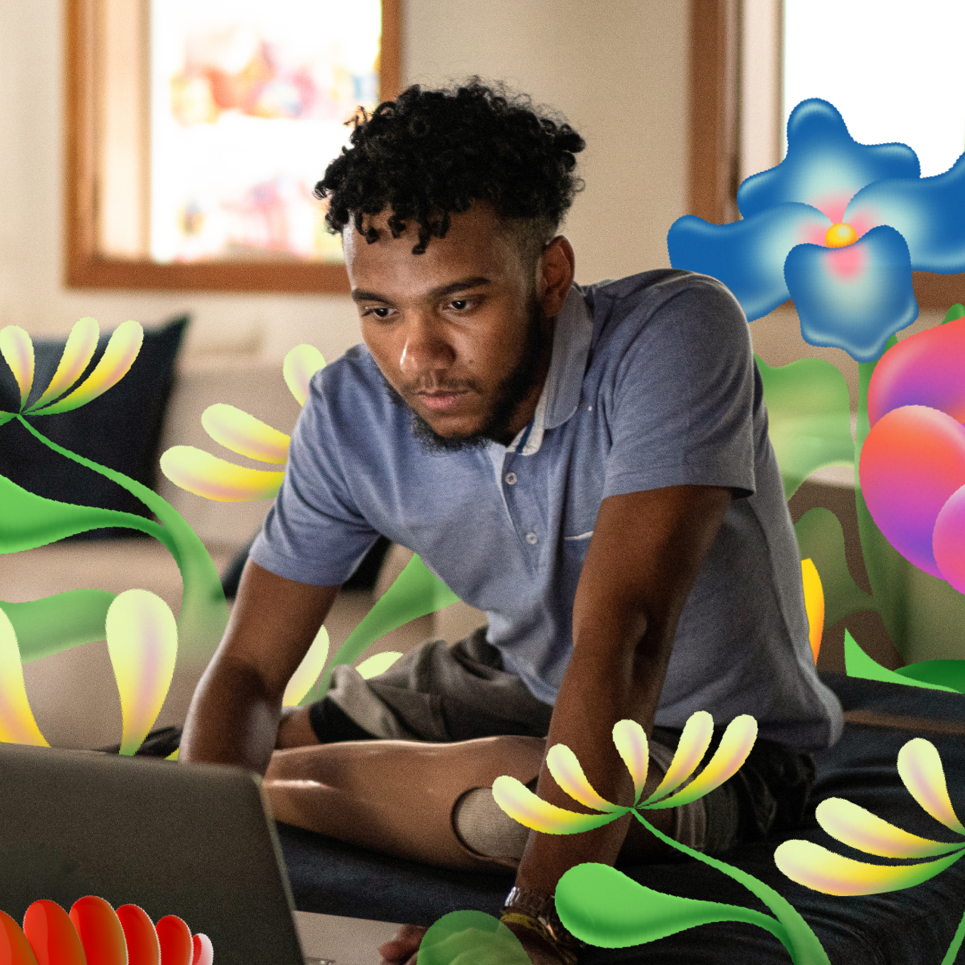 A person with a prosthetic leg, wearing a blue shirt, sits indoors using a laptop, with colorful floral graphics surrounding them.