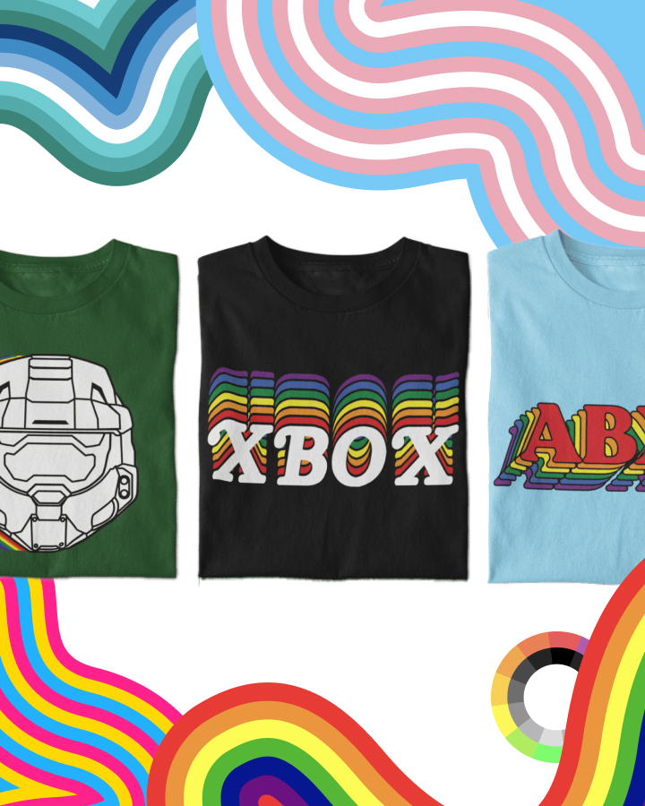 Three colorful T-shirts on display: green with a helmet design, black with "XBOX" in multicolored letters, and light blue with "ABC" in similar colorful letters, set against a wavy patterned background.