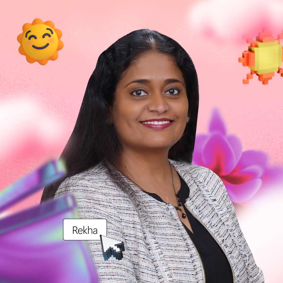 A person with long hair smiles, wearing a patterned blazer. The background is pink with digital floral and sun graphics. A cursor points to a text box labeled "Rekha.
