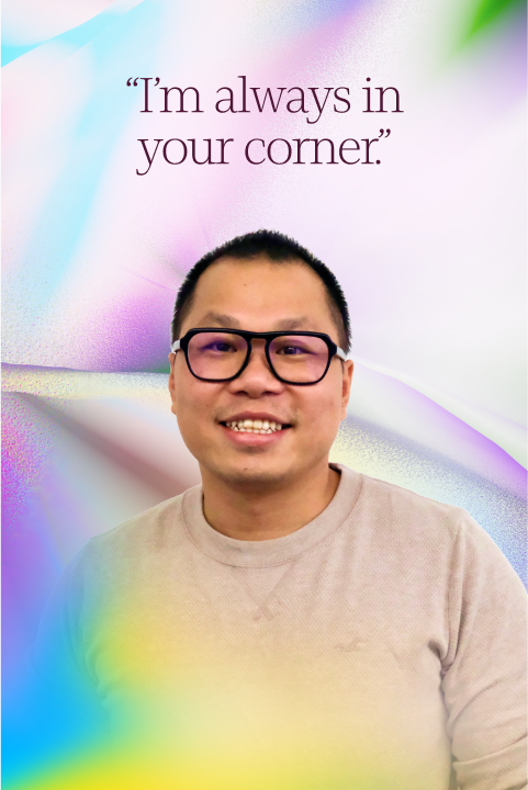 A man wearing glasses and a beige sweater smiles in front of a pastel, abstract background with the text, “I’m always in your corner.” at the top.