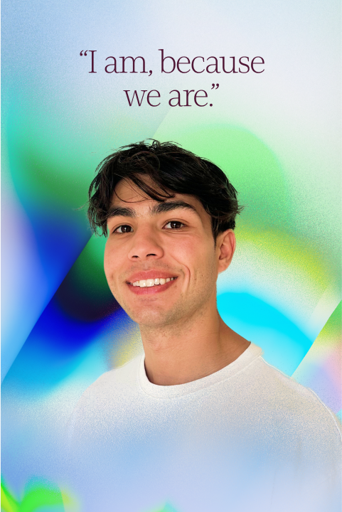 A young person with dark hair smiles at the camera, standing in front of a colorful abstract background with the text, "I am, because we are.