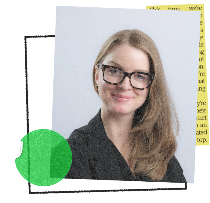 Lisa Reppel, a woman with long blonde hair wearing tortoiseshell glasses and a dark blazer, smiling against a light gray background